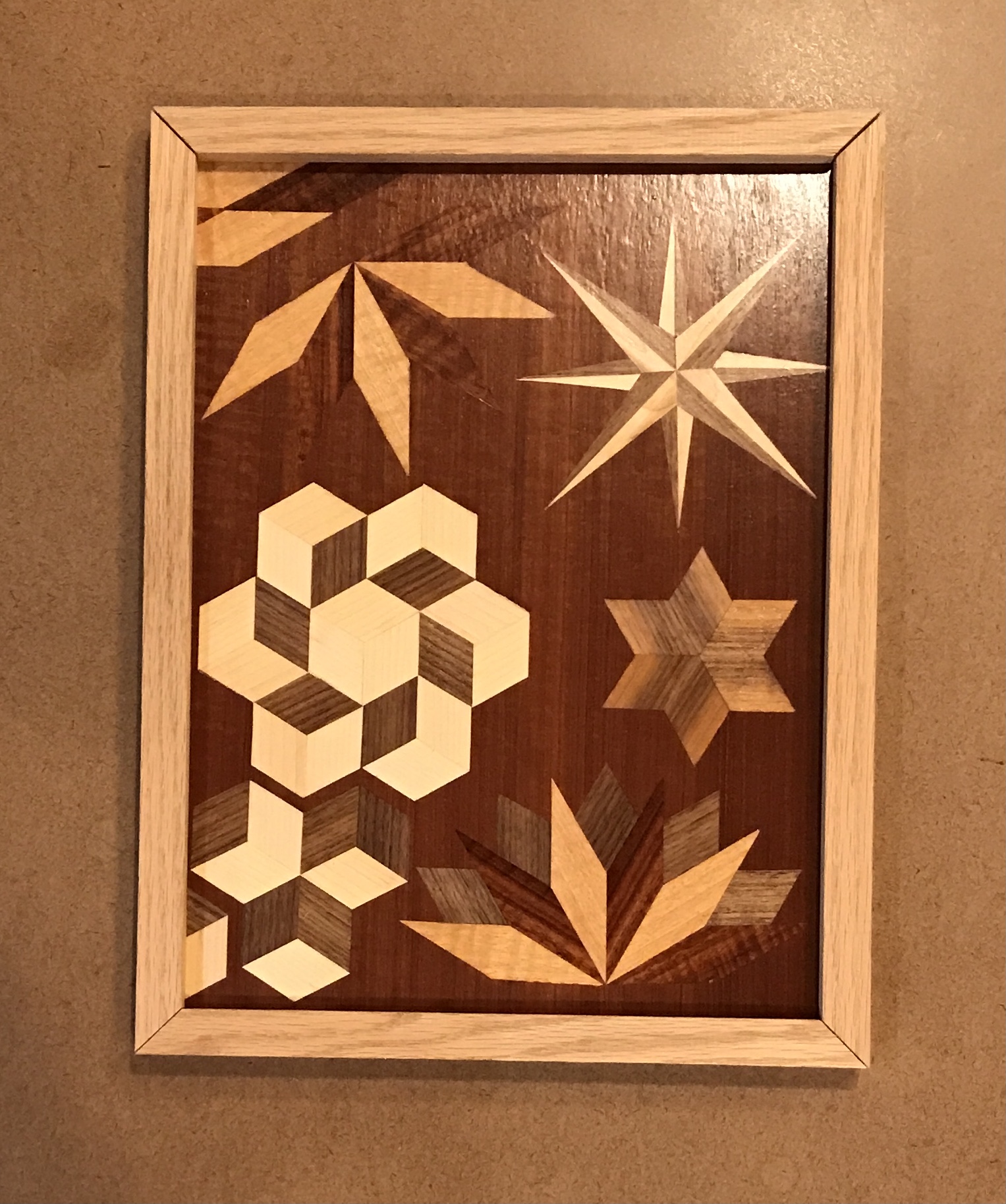 The frame members arranged around the parquetry piece